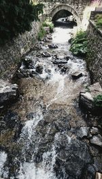 Arch bridge over river stream