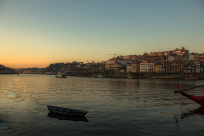 Scenic view of river against sky during sunset