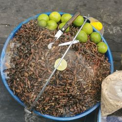 High angle view of fruits in basket on table
