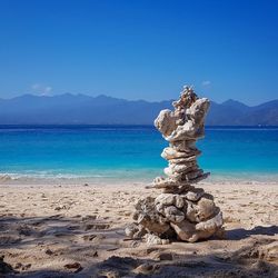 Scenic view of sea against blue sky