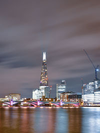 Illuminated buildings in city at night