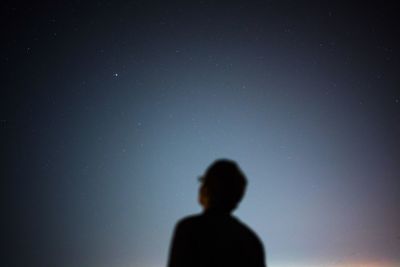 Low angle view of people at night