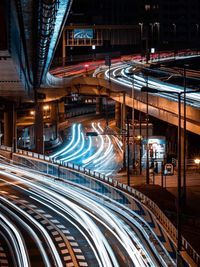 Light trails on highway in city at night