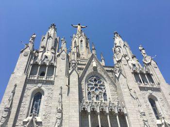 Low angle view of building against blue sky