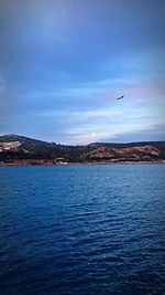 Scenic view of sea against blue sky