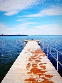 Pier over sea against sky