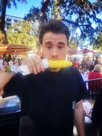 Portrait of man eating food in restaurant