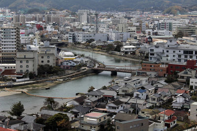 High angle view of river amidst buildings in city