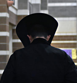 Rear view of man wearing hat