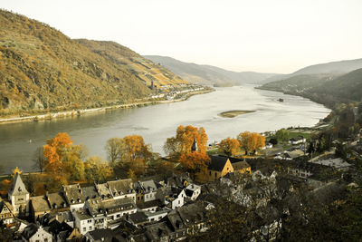 High angle view of river by buildings against sky