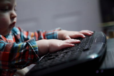 Close-up of baby boy using computer