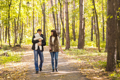 Full length of woman walking in forest