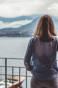 Rear view of woman looking at sea