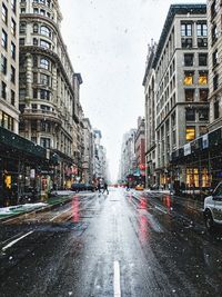 Wet street in city during rainy season