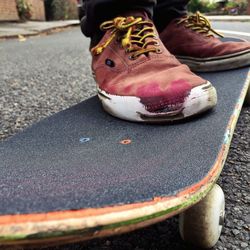 Low section of person on skateboard