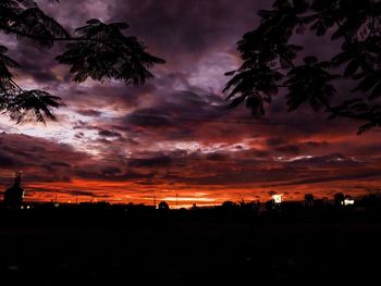 Scenic view of silhouette landscape against dramatic sky