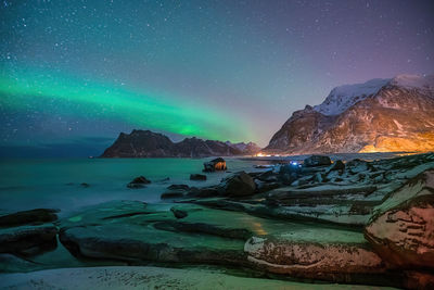 Scenic view of sea against sky at night