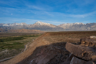 Owens river valley cliff view distant snowy peaks of eastern sierra nevada mountains california usa