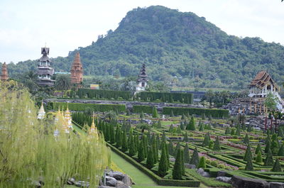 Panoramic view of buildings and mountains against sky