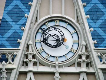 Low angle view of clock on building