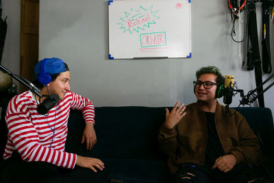 Two young men having a conversation on a podcast