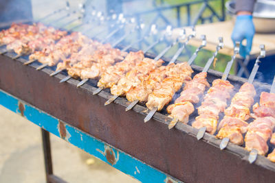 High angle view of meat on barbecue grill