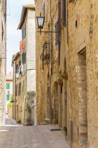 Narrow alley amidst buildings in city