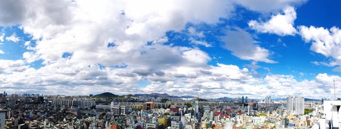 High angle view of townscape against cloudy sky