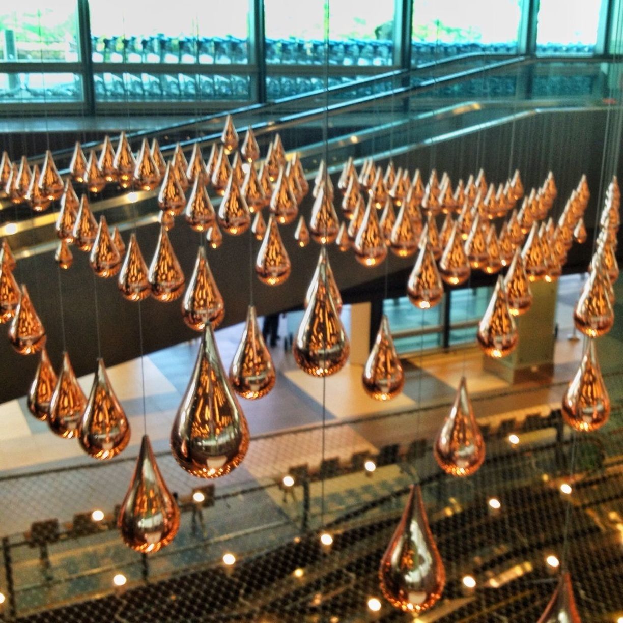 indoors, in a row, large group of objects, arrangement, table, abundance, high angle view, design, decoration, built structure, architecture, metal, repetition, railing, pattern, ornate, no people, illuminated, tradition, incidental people