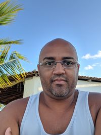 Portrait of mature man against sky