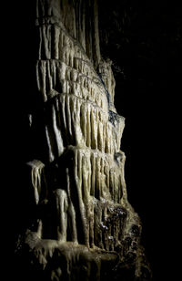 Close-up of statue against black background