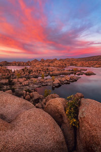 Scenic landscape with a dramatic sunset over watson lake in prescott, arizona