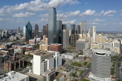 High angle view of cityscape against cloudy sky