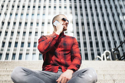 Full length of young man against building in city