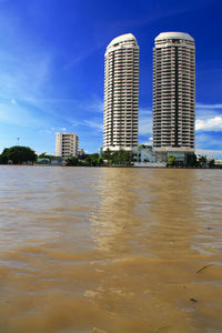 City skyline against blue sky