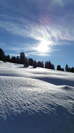 Scenic view of landscape against cloudy sky