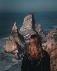 Rear view of woman looking at sea