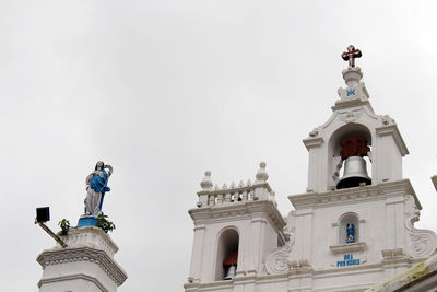 Low angle view of statue against building