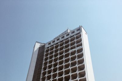 Low angle view of building against clear blue sky