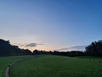 Scenic view of field against sky during sunset