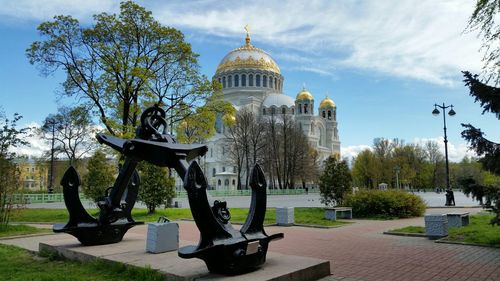 Structure by cathedral against sky