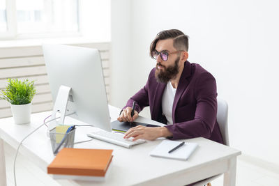 Young man working on table