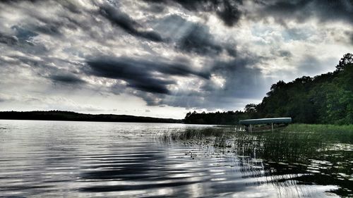 Scenic view of sea against cloudy sky