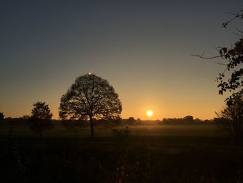 Scenic view of landscape at sunset