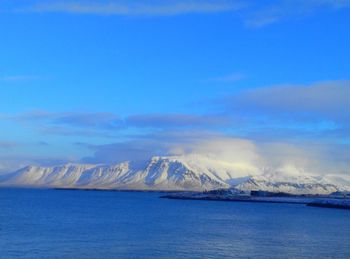 Scenic view of sea against blue sky