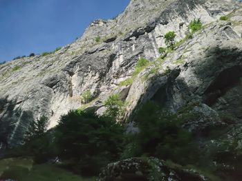 Low angle view of rocks against sky