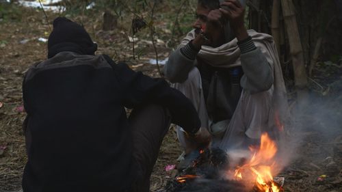 People in traditional clothing during winter