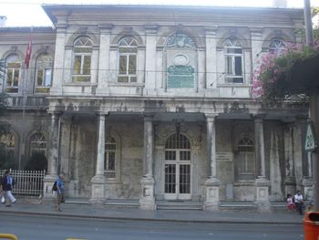 Woman standing in front of building