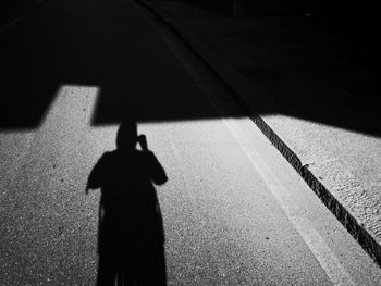 Shadow of people on road