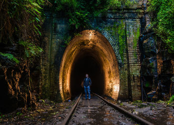 Man walking in tunnel